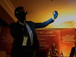 Gemologist Ashan Amarasinghe holds what is said to be the world's largest purple star sapphire at a ceremony in Colombo, Sri Lanka, Saturday, Jan. 17, 2026.  