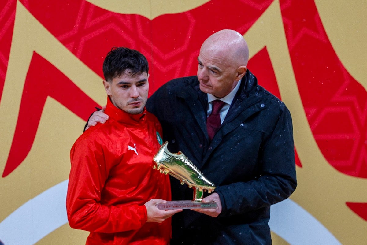 Morocco's forward #10 Brahim Diaz receives the Golden Boot from FIFA President Gianni Infantino during presentation ceremony at the end of the Africa Cup of Nations (CAN) final football match between Senegal and Morocco at the Prince Moulay Abdellah Stadium in Rabat on January 18, 2026.