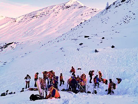 In this photo provided by the Bergrettung Pongau (Mountain Rescue Pongau), rescuers search for people after an avalanche in the Salzburg Pongau region of western Austria, Saturday, Jan. 17, 2026.