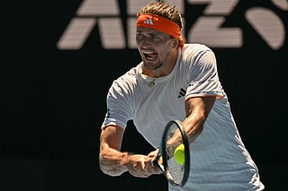 Germany's Alexander Zverev hits a return to Canada's Gabriel Diallo during their men's singles match on day one of the Australian Open tennis tournament in Melbourne on January 18, 2026.