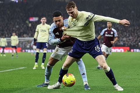 Everton's Irish defender Jake O'Brien (R) clashes with Aston Villa's English midfielder Morgan Rogers (L) during the English Premier League football at Villa Park in Birmingham, central England on January 18, 2026.