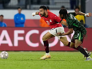 Egypt's Mohanad Lasheen, left, chases the ball with Nigeria's Ademola Lookman during the Africa Cup of Nations third place game in Casablanca, Morocco, Saturday, January 17, 2026.  