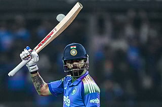 India's Virat Kohli celebrates after scoring a century (100 runs) during the third one-day international (ODI) cricket match between India and New Zealand at the Holkar Cricket Stadium in Indore on January 18, 2026.