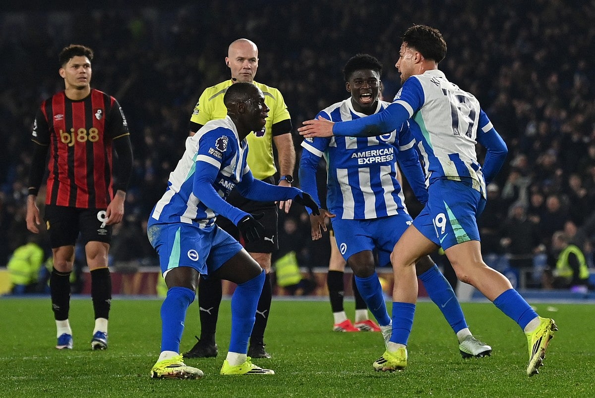 Brighton's Greek striker #19 Charalampos Kostoulas (R) celebrates scoring the equalising goal with Brighton's Cameroonian midfielder #17 Carlos Baleba during the English Premier League football match between Brighton and Hove Albion and Bournemouth at the American Express Community Stadium in Brighton, southern England on January 19, 2026.
