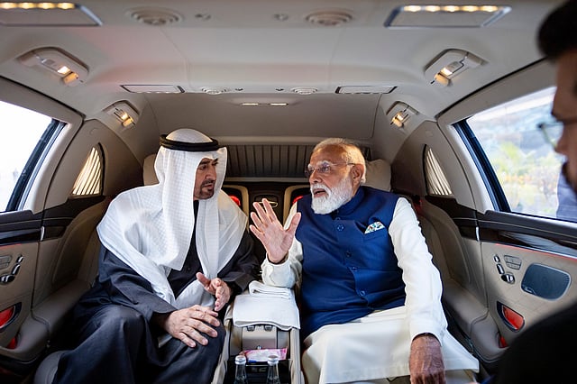 Sheikh Mohamed with PM Modi on their way to their meeting venue.