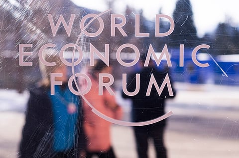 The logo of the World Economy Forum is displayed on a window of the Congress Center where the Annual Meeting Forum take place in Davos, Switzerland, Sunday, Jan. 18, 2026.