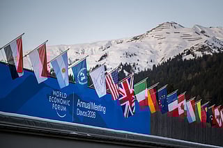 Graphic content / A sign of the World Economic Forum (WEF) is seen on the top of the Congress Centre that hosts the WEF annual meeting in the Alpine resort of Davos on its opening day in Davos on January 19, 2026.