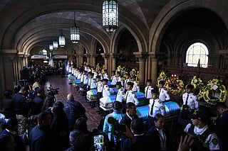 The wake for police officers killed while retaking control of three prisons is held at the Interior Ministry in Guatemala City, Monday, Jan. 19, 2026. (AP Photo/Moises Castillo)