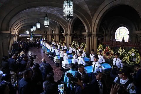 The wake for police officers killed while retaking control of three prisons is held at the Interior Ministry in Guatemala City, Monday, Jan. 19, 2026. (AP Photo/Moises Castillo)