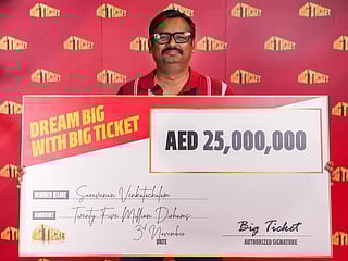 Indian expat Saravanan Venkatachalam with the Dh25 million cheque he won in Big Ticket Grand Prize Series 280.