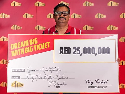 Indian expat Saravanan Venkatachalam with the Dh25 million cheque he won in Big Ticket Grand Prize Series 280.