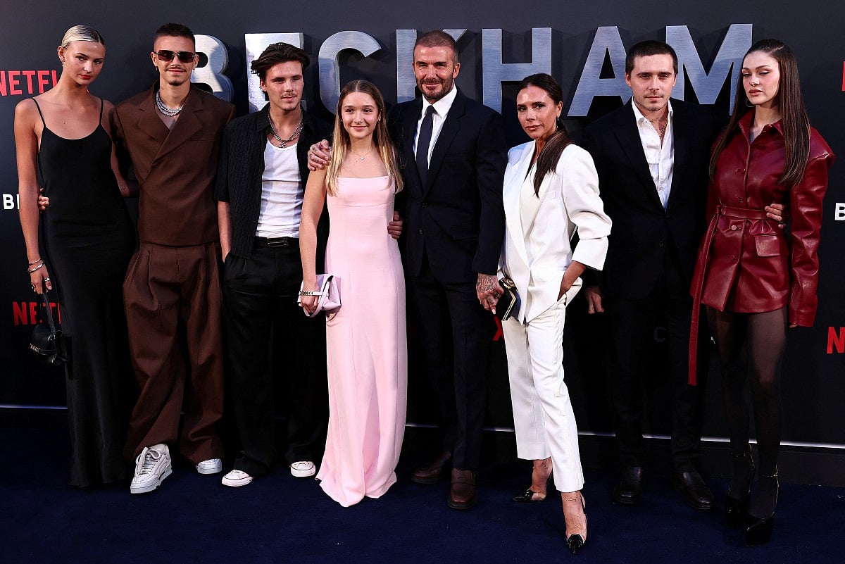 Former England footballer David Beckham (5th L) and his wife Victoria Beckham (3rd R) pose on the red carpet with their children and partners, (from L) Mia Regan, Romeo Beckham, Cruz Beckham, Harper Beckham, Brooklyn Beckham and Nicola Peltz Beckham upon arrival to attend the premiere of "Beckham" in London on October 3, 2023.