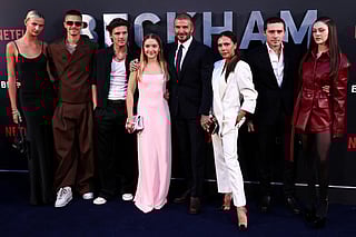 Former England footballer David Beckham (5th L) and his wife Victoria Beckham (3rd R) pose on the red carpet with their children and partners, (from L) Mia Regan, Romeo Beckham, Cruz Beckham, Harper Beckham, Brooklyn Beckham and Nicola Peltz Beckham upon arrival to attend the premiere of "Beckham" in London on October 3, 2023.
