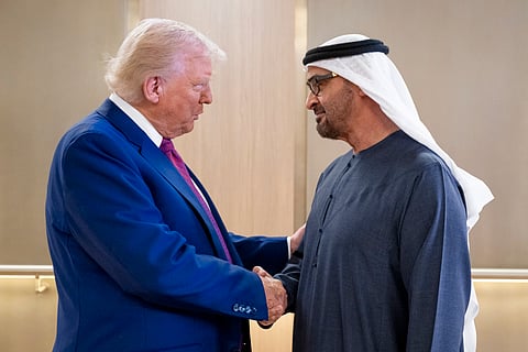 President His Highness Sheikh Mohamed bin Zayed Al Nahyan welcomes US President Donald Trump at the Presidential Airport in Abu Dhabi during a state visit on May 15, 2025.