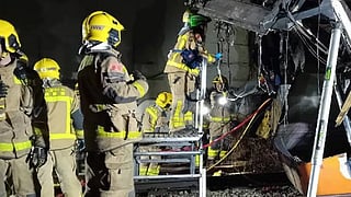 Emergency workers inspect the wreckage of the train in Catalonia, Spain.