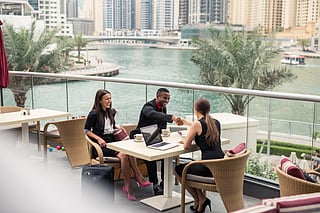 Businesspeople having a meeting outdoors.