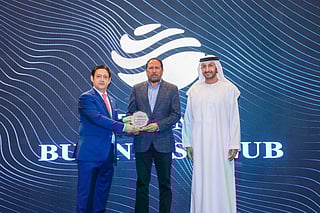 Ashfaq Ahmed, Managing Editor of Gulf News, being presented an award by former Ambassador Javed Malik and Abdulla Al Saleh, Undersecretary at the Ministry of Economy and Tourism, at the Diplomat Business Club, Dubai.