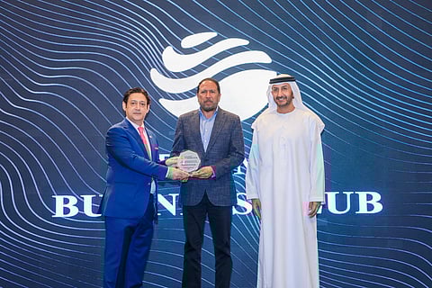 Ashfaq Ahmed, Managing Editor of Gulf News, being presented an award by former Ambassador Javed Malik and Abdulla Al Saleh, Undersecretary at the Ministry of Economy and Tourism, at the Diplomat Business Club, Dubai.
