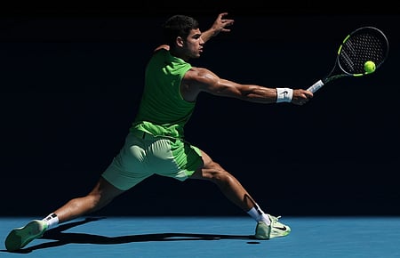 Alcaraz survives longest first set of his career at a major to move into Aus Open third round