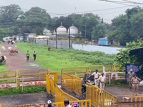Police personnel stand guard outside the Bhojshala in Madhya Pradesh.
