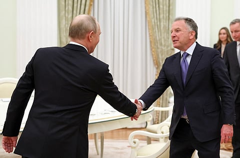 In this pool photograph distributed by the Russian state agency Sputnik, Russia's President Vladimir Putin and US special envoy Steve Witkoff shake hands during a meeting at the Kremlin in Moscow on January 22, 2026.