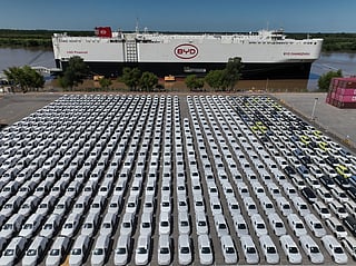 The BYD Changzhou car carrier is docked at Terminal Zarate in the Buenos Aires province of Argentina, Tuesday, Jan. 20, 2026, where hybrid and electric vehicles shipped from China are parked next to the ship. (AP Photo/Victor R. Caivano)