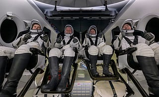 Roscosmos cosmonaut Oleg Platonov, left, NASA astronauts Mike Fincke, Zena Cardman, and JAXA (Japan Aerospace Exploration Agency) astronaut Kimiya Yui are seen inside the SpaceX Dragon Endeavour spacecraft onboard the SpaceX recovery ship Shannon shortly after having landed in the Pacific Ocean off the coast of Long Beach, Calif., Thursday, Jan. 15, 2026.