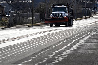A Nashville Department of Transportation truck applies salt brine to a roadway Thursday, Jan. 22, 2026, in Nashville, Tenn. ahead of a winter storm expected to hit the state over the weekend.