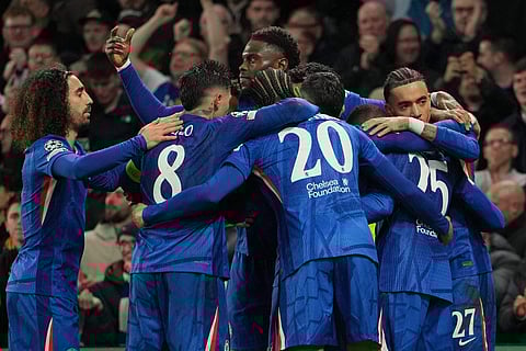 Chelsea players celebrate after scoring during the Champions League