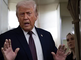  US President Donald Trump speaks to reporters over the North Atlantic as he returns to Washington from the World Economic Forum (WEF) in Davos, Switzerland, aboard Air Force One.