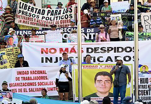 Salvadoran activists take part in a protest against President Nayib Bukele's policies -including the state of emergency, within the anti-gang crackdown, in force since March 2022 and which allows arrests without a warrant- in San Salvador, on January 25, 2026.