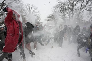 New Yorkers revel in snowball fight amid storm