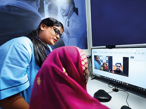 Taking primary care closer: A patient during a remote teleconsultation at CureBay's e-clinic.