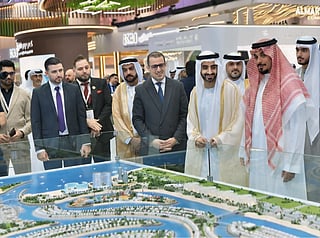 Sheikh Dr Salem bin Abdulrahman bin Salem Al Qasimi, Chairman of the Ruler’s Office in Sharjah, with Sultan Al Shakrah, Chairman of Ajmal Makan Real Estate Development, and Farid Jamal,Chief Commercial Officer, during the ACRES 2026.