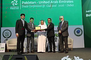Dr Mohammed Saeed Al Kindi, former UAE Minister of Water and Environment receiving shield from Hussain Muhammed; Ali Khan and Athar Hussain Khokhar at the event in Dubai