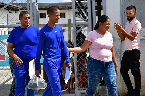 Ricardo Gámez, left, leaves prison after being released in Tocuyito, Venezuela, Sunday, Jan. 25, 2026.  