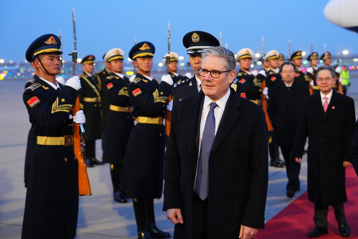Britain's Prime Minister Keir Starmer is welcomed upon his arrival at an airport in Beijing on January 28, 2026.