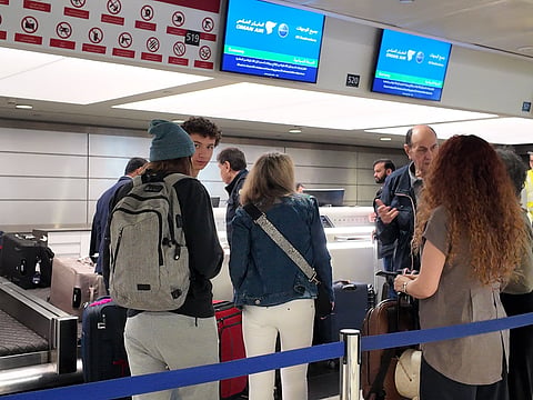 Travellers at Dubai International Airport in December 2025. 