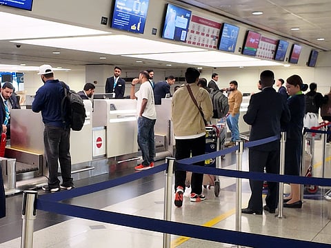 Travellers at Dubai International Airport in December 2025. UAE residents flying to India are being advised to stay alert and follow health precautions amid fresh Nipah virus alerts in parts of India. 