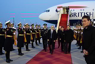 Britain's Prime Minister Keir Starmer is welcomed upon his arrival at an airport in Beijing on January 28, 2026.