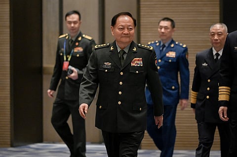 China's vice chairman of the CPC Central Military Commission and vice chairman of the Central Military Commission of the People's Republic of China Zhang Youxia (C) arrives for a group photo before the opening ceremony of the 19th Western Pacific Naval Symposium in Qingdao, China's Shandong province on April 22, 2024.