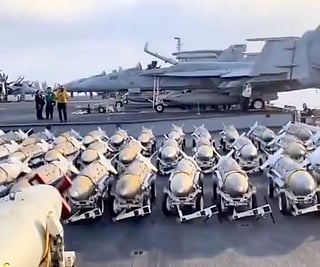 A scene on the flight deck of a US aircraft carrier. The USS Abraham Lincoln has reportedly been repositioned in the Middle East region to bolster Trump's threat against Iran.