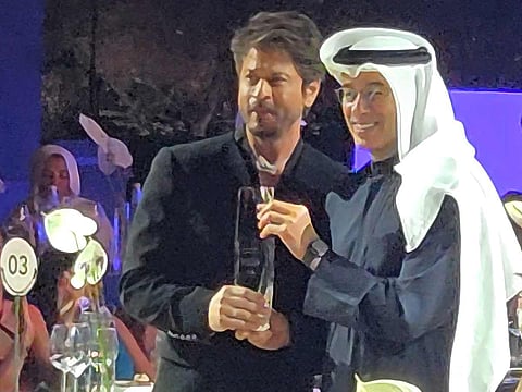 Mohamed Alabbar, founder of Emaar Properties, presents the award to Shah Rukh Khan.