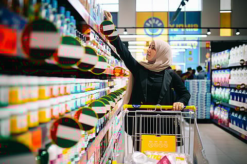A shopper browses the aisles at a Sava discount store in the UAE.