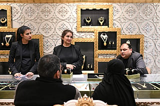 Customers buy gold necklaces at a jewellery store in New Delhi 