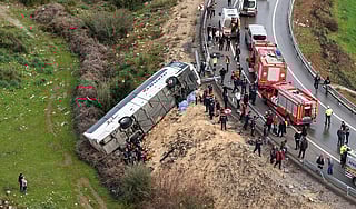 This handout photograph taken and released on February 1, 2026 by Turkish news agency DHA  shows an aerial view of a Bus accident where first aid official work in Antalya.