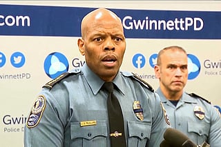 An image taken from WSB video shows Gwinnett County Police Chief J.D. McClure speaks at a news conference Sunday, Feb. 1, 2026, in Gwinnett County, Ga., following the shootings of two officers at a hotel. 