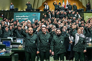 In this handout picture provided by Ithe Islamic Consultative Assembly News Agency (ICANA), members of Iran's parliament dressed in IRGC uniforms, chant "Death to America" during a session in Tehran on February 1, 2026,