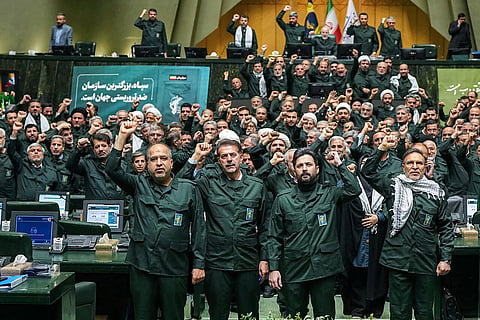 Members of Iran's parliament dressed in IRGC uniforms, chant "Death to America" during a session in Tehran on February 1, 2026,