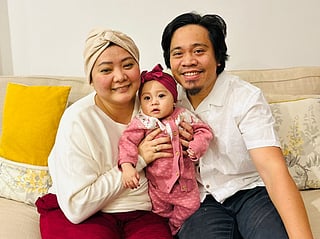 Rubelle Banguis with her husband and baby girl after a challenging journey to motherhood.